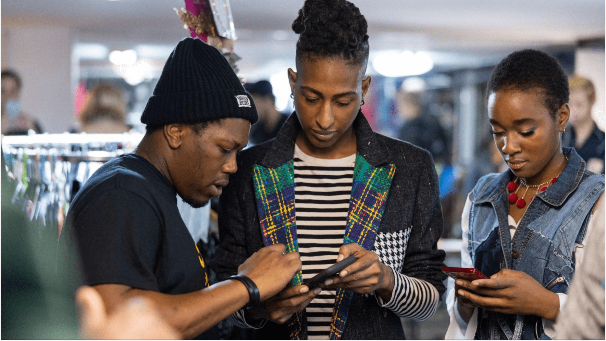 three people using their phone