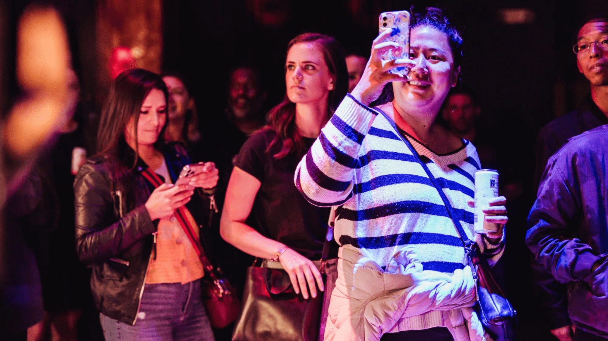 attendees with their phones