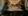 Crowd of diners sit at table chatting