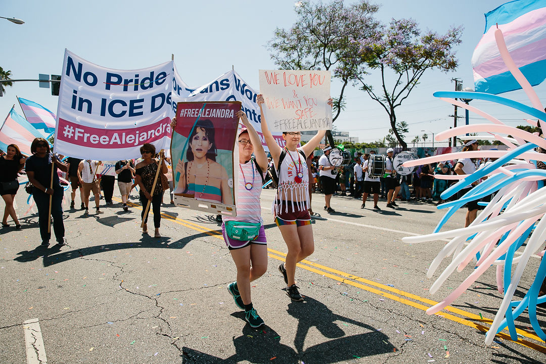 people with banners on Pride march